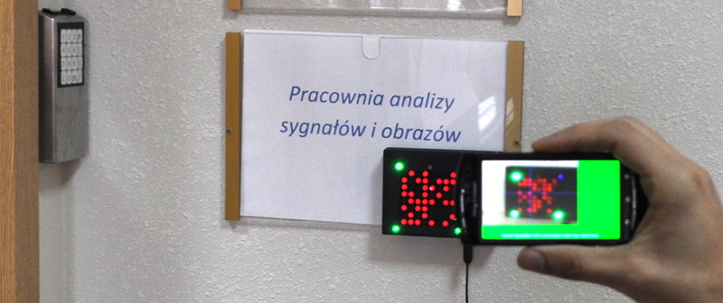 An element of the local navigation system mounted near the door of the room